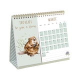 Desk calendar with a beaver illustration and text 'Too glam to give a damn' on a white background.