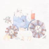 Baby romper in white with green and white sleevews and a tractor print on the front.