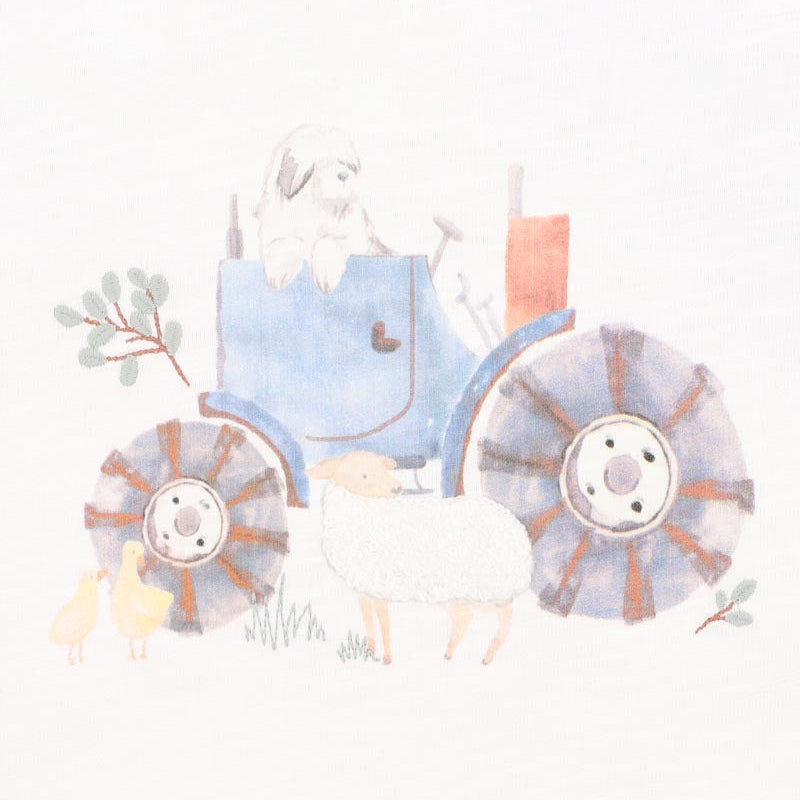 Baby romper in white with green and white sleevews and a tractor print on the front.