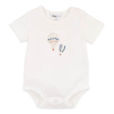 White baby onesie with hot air balloon design on a white background