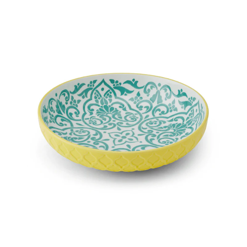 Decorative bowl with yellow rim and green pattern on a white background