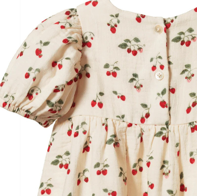 Children's dress with cherry pattern on a white background