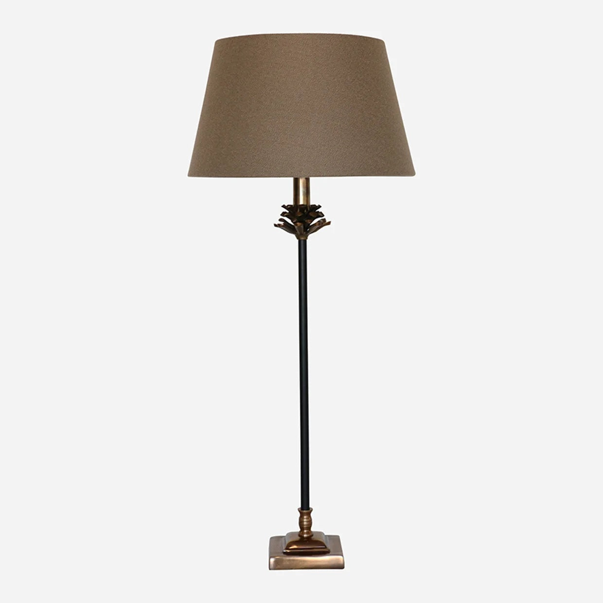 CC Interiors Pine Cone Lamp Base in Antique Brass and Black finish at Cerise.  Add character and timeless elegance to your interior with the CC Interiors Pine Cone Lamp Base in Antique Brass and Black Finish. Featuring a distinctive pine cone-inspired design, this decorative lamp base combines warm antique brass tones with classic black detailing for a sophisticated, sculptural look.