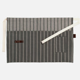 Sophie Conran waist garden apron from Burgon Ball at Cerise. Made from 100% cotton in a grey ticking stripe with leather hanging loop.  Has large of deep utililty pocket and storage for gardn tools as well as smaller pocket for keys and smaller items,