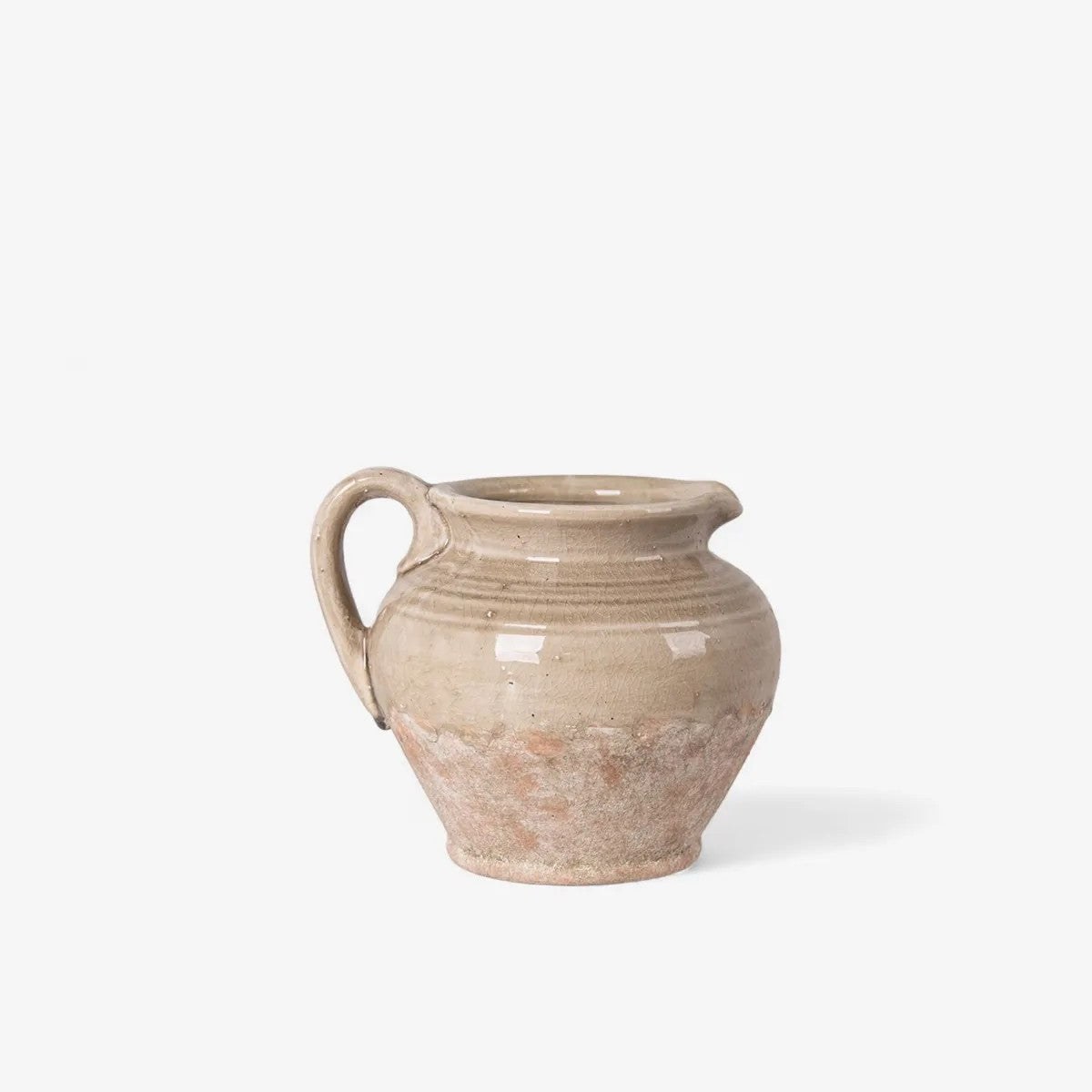 Stone coloured half glazed ereracotta jug with single handle