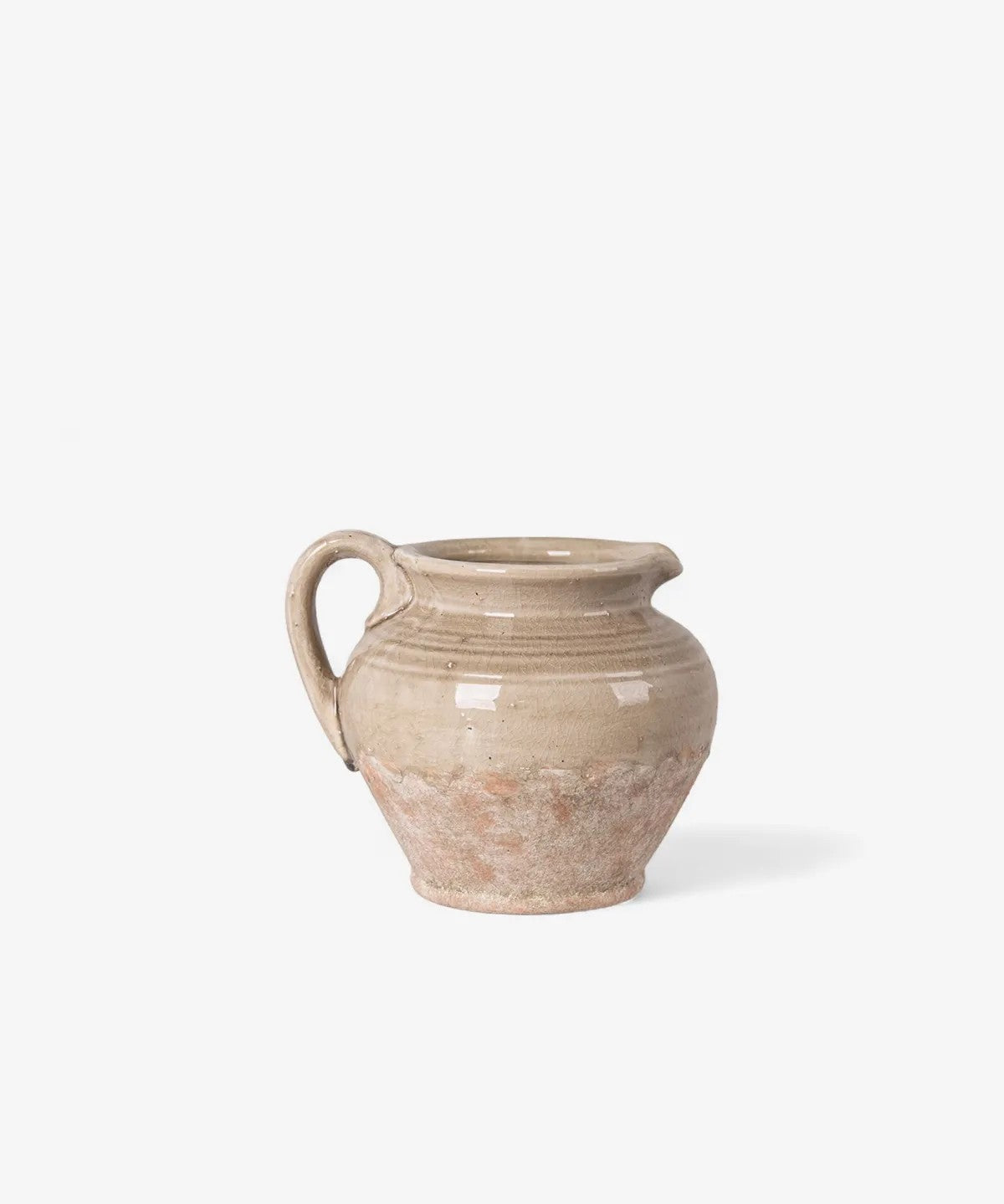 Stone coloured half glazed ereracotta jug with single handle