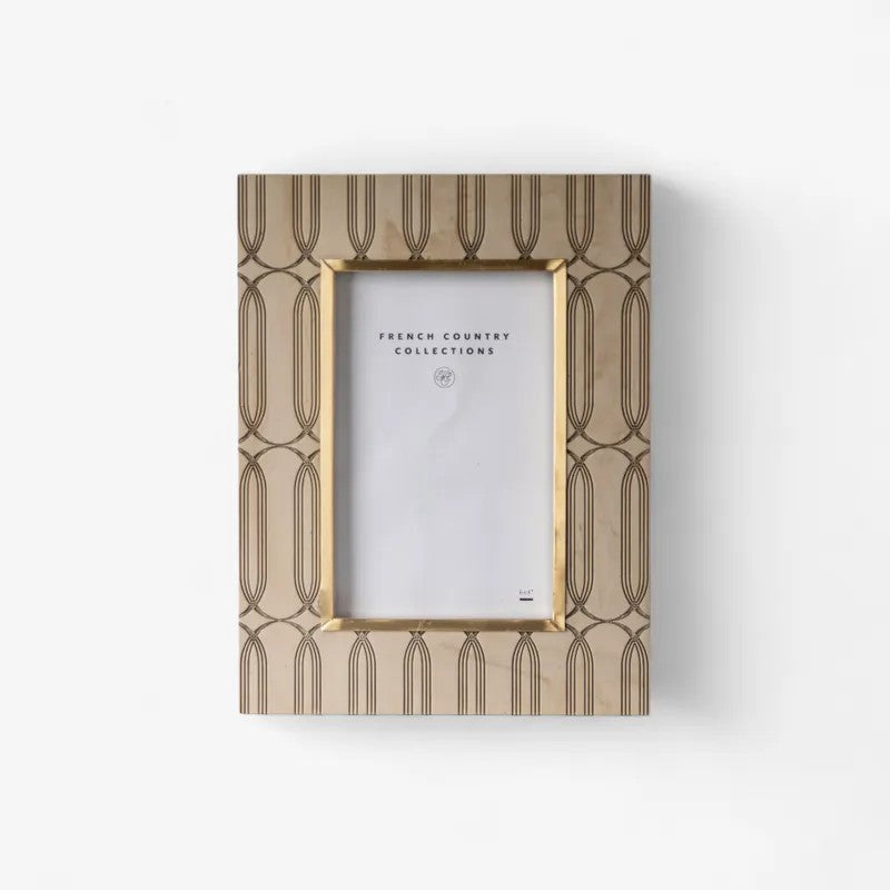 Decorative picture frame with geometric pattern on a white background