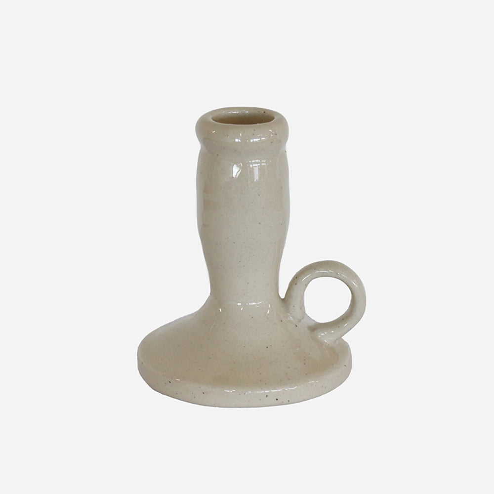 CC Interiors Lisette Candle Holder at Cerise.  Mde from natural-coloured ceramic, this lovely little taper candle holder combines simple, organic styling with a practical handle, making it easy to move and display wherever you want a little extra ambience.