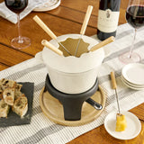Beige coloroued fondue set on wooden base with wooden handle forks