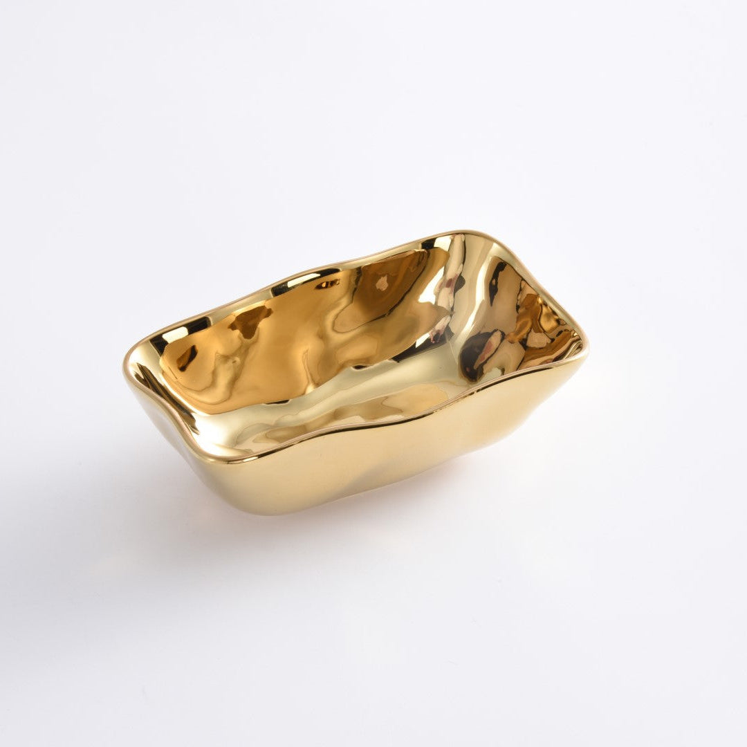 Gold-colored rectangular dish on a white background