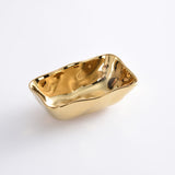 Gold-colored rectangular dish on a white background