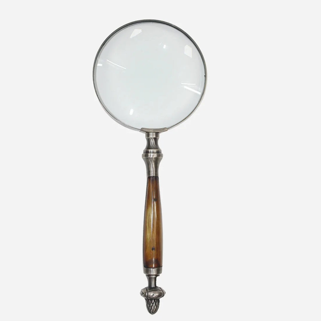 CC Interiors magnifying glass with bone handle and acorn detail at Cerise