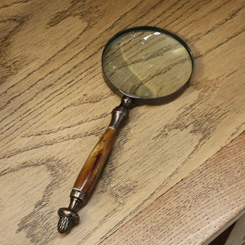 CC Interiors magnifying glass with bone handle and acorn detail at Cerise