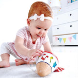 Baby playing with the Hape rotating musical box at Cerise