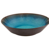 Bowl with blue interior and brown exterior on a white background