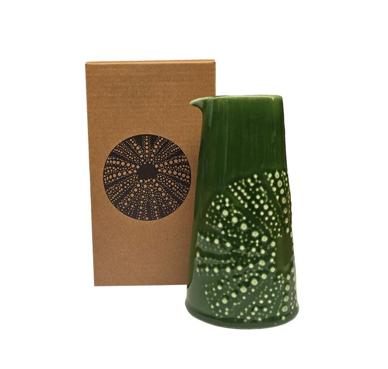Green coloured ceramic handleless jug with embossed kina design
