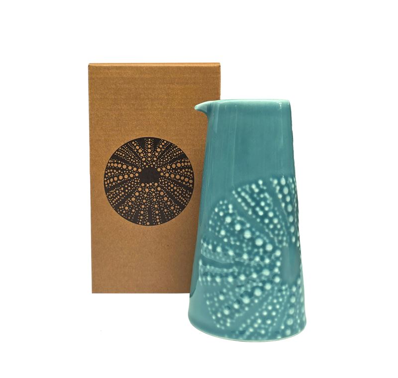 Blue coloured ceramic handleless jug with embossed kina design