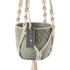 Gray patterned pot in a macrame hanger with Burgon & Ball tag on a white background