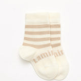 Lamington Merino Baby Socks in Squireel design at Cerise. Features white with oatmeal stripe for newborn baby gift.