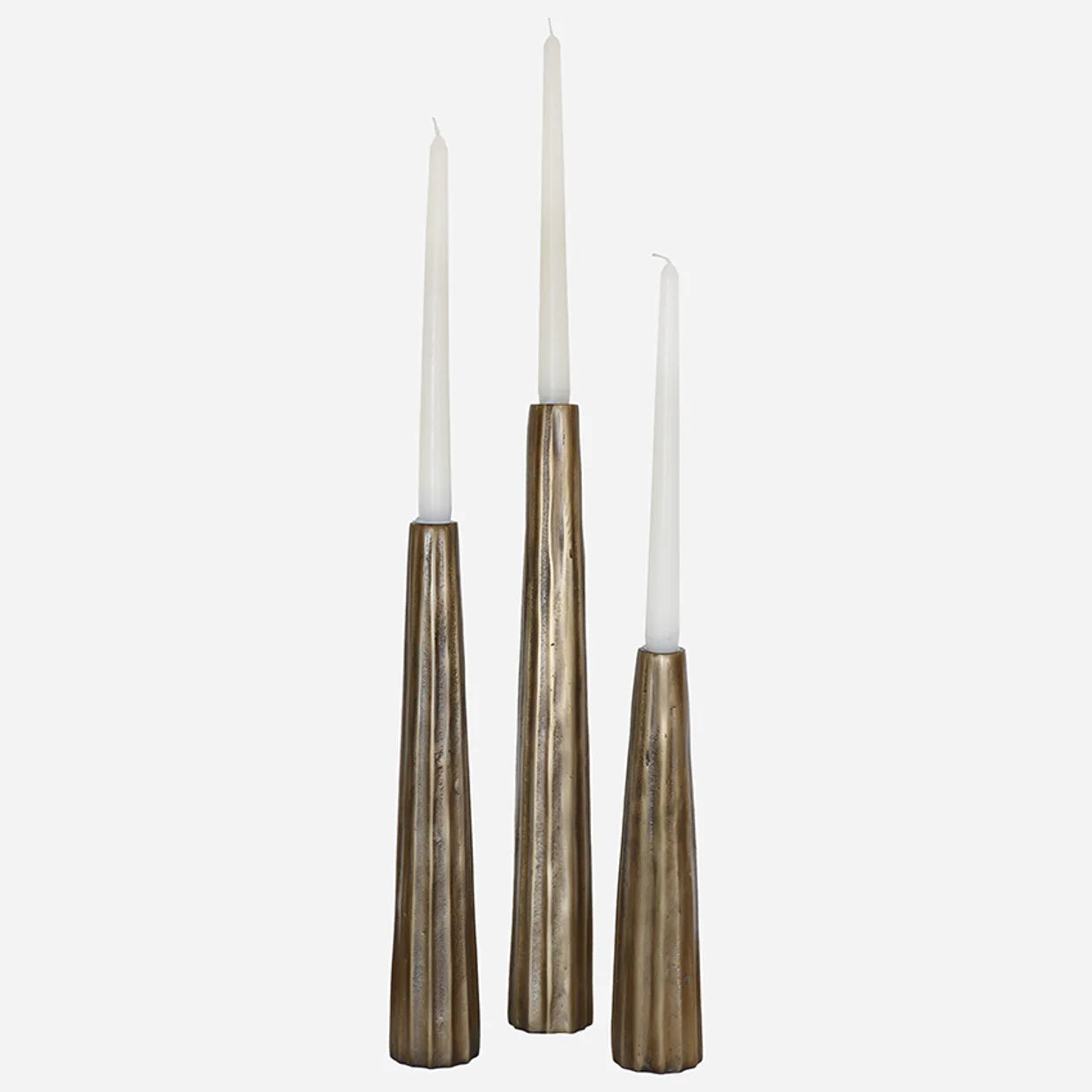 CC Interiors Sculpted Ribbed Candlesticks in Antique Brass Finish at Cerise with distinctive ribbed detailing. 

Available in three sizes – Small, Medium and Large – the collection offers endless styling possibilities. Create a beautifully layered display by combining all three sizes as a set, or style them as matching pairs for a more symmetrical and balanced look.