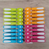 Laguelle Non Slip Flower Pegs at Cerise.  Soft grip, non marking and non slip 20 pack feturing the iconic Laguelle Flower, made in France.