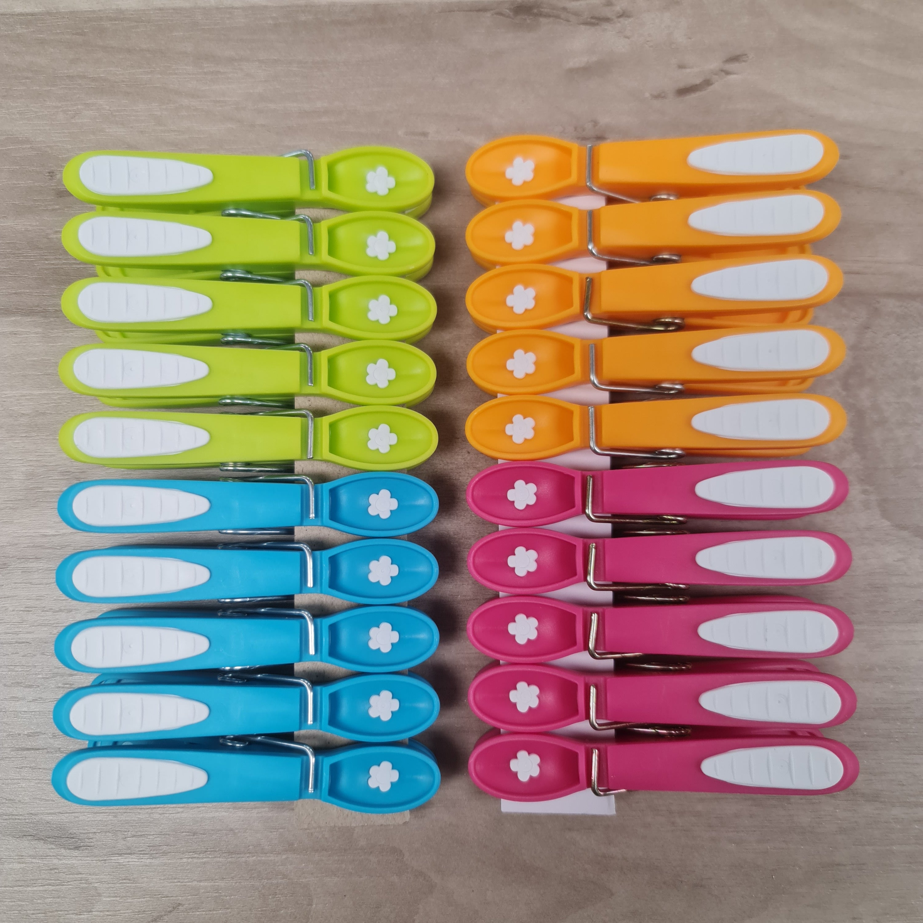 Laguelle Non Slip Flower Pegs at Cerise.  Soft grip, non marking and non slip 20 pack feturing the iconic Laguelle Flower, made in France.