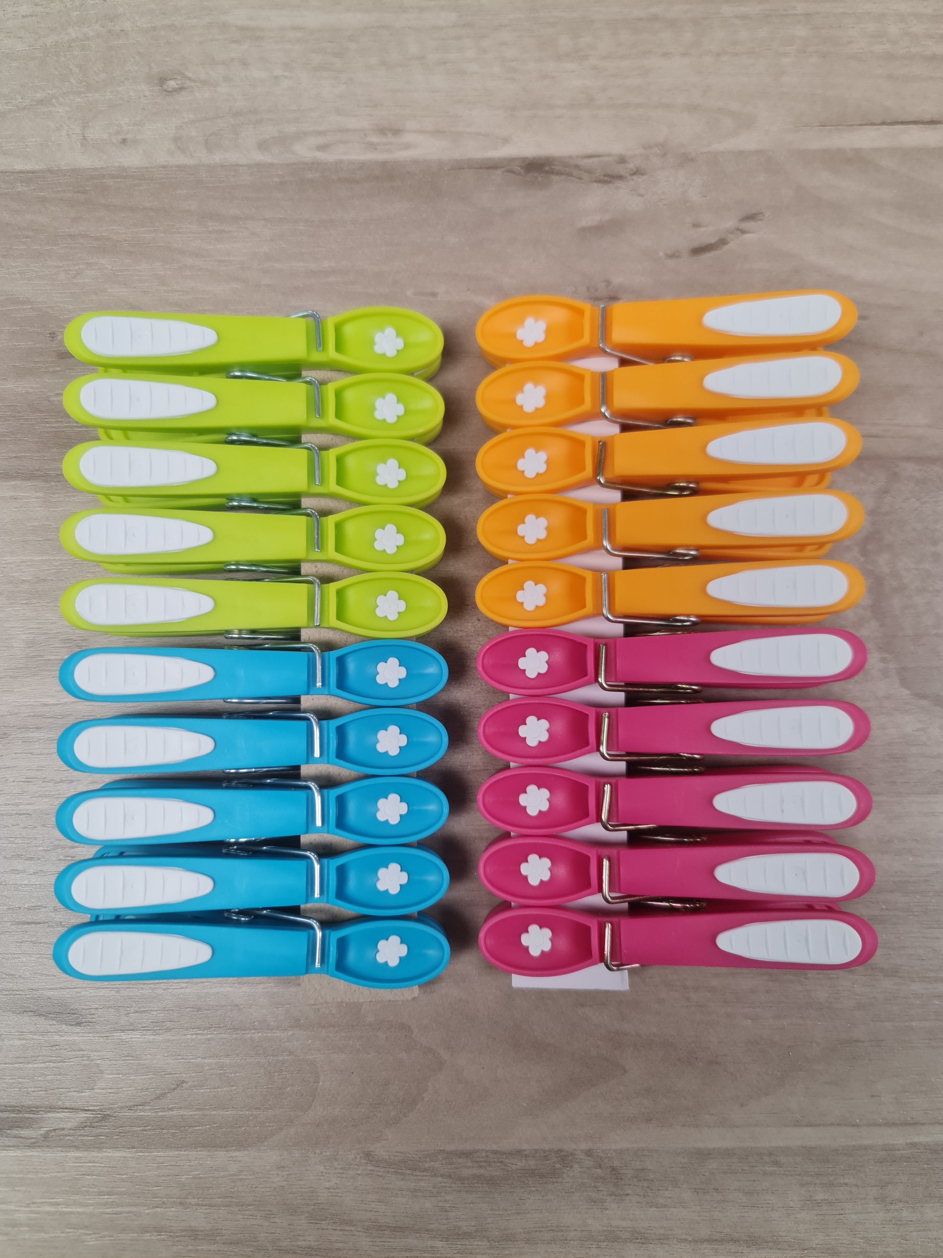 Laguelle Non Slip Flower Pegs at Cerise.  Soft grip, non marking and non slip 20 pack feturing the iconic Laguelle Flower, made in France.
