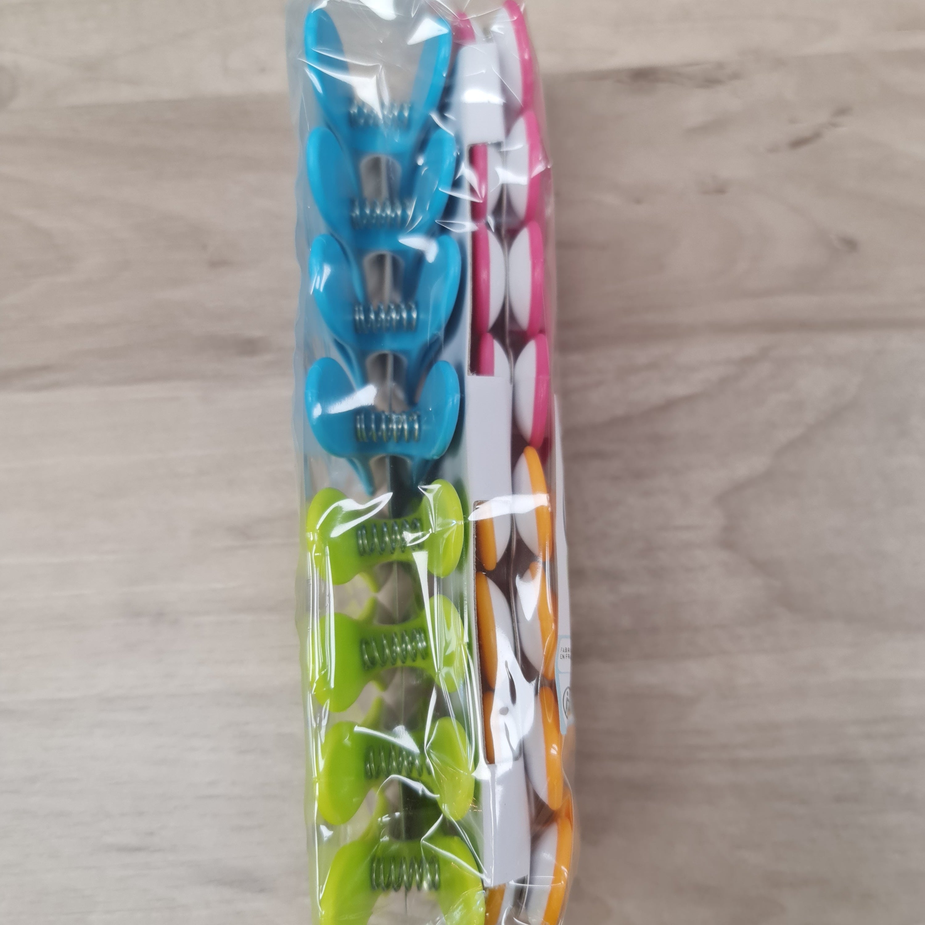 Laguelle Soft Grip Pegs made in France and available in store and online at Cerise.  Strong and reliable for both inside and outside use.  Each Pack includes 16 pegs, a mixture. of Pink, Orange,  Blue and Green.  Non marking and long lasting, these are quite possibly the best pegs ever.