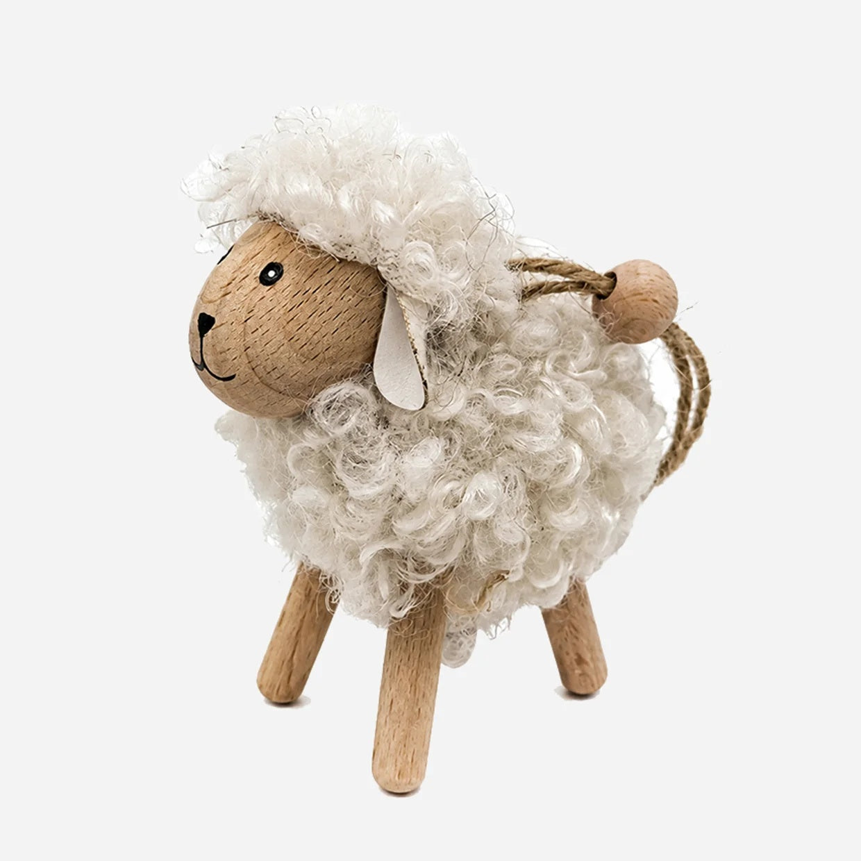 CC Interiors urly White hanging sheep with wooden legs and face at Cerise