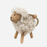CC Interiors urly White hanging sheep with wooden legs and face at Cerise