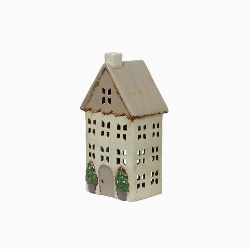 Cream Tealight house with lots of windows and a stone pot with tree either side of the doorway