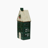 Tealight house painted green with a cream roof and a wreath featured on the front.
