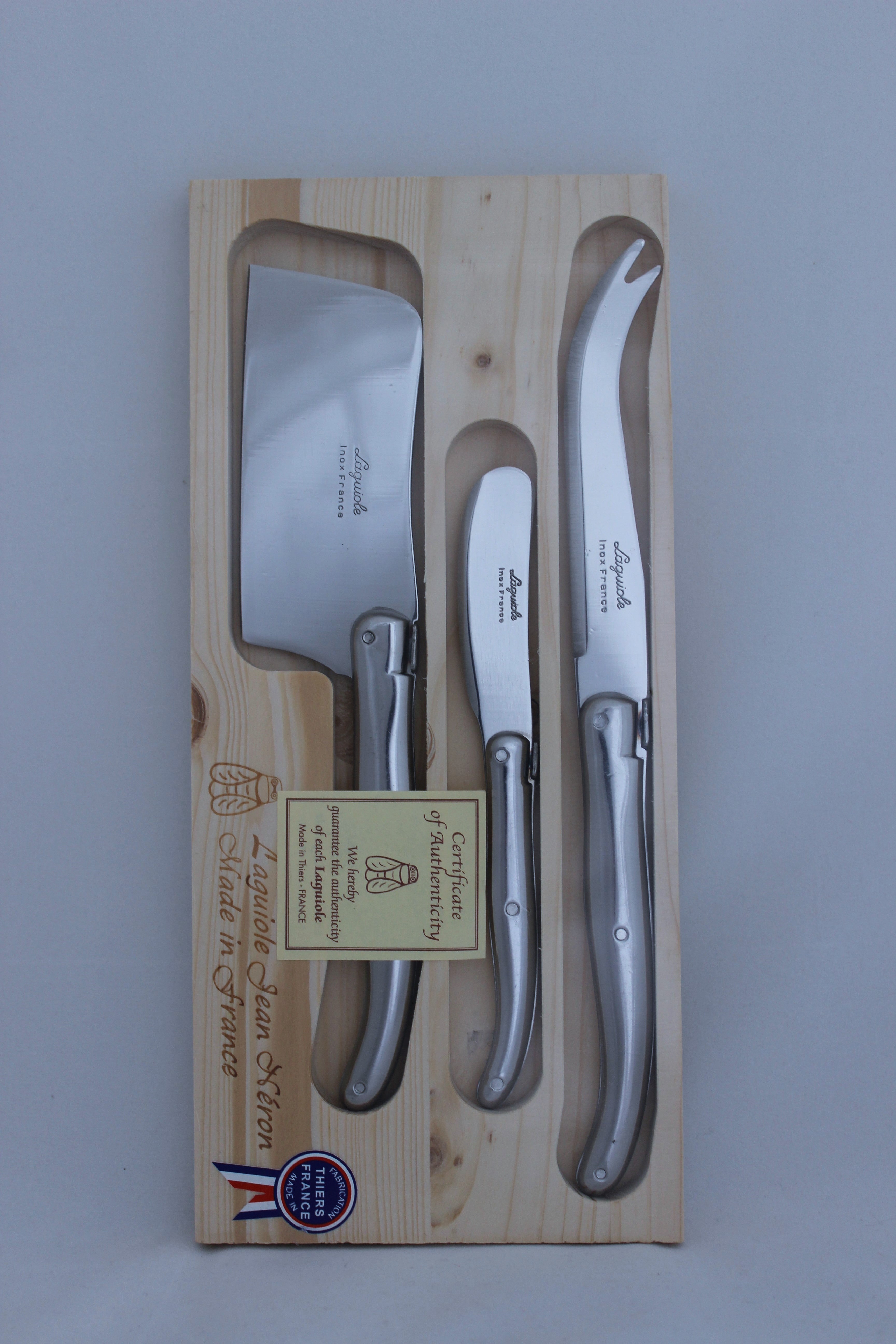 Laguiole three piece stainless steel cheese set including a cheese knife, cheese hatchett and butter knife.  Presented in a wooden gift box at Cerise NZ