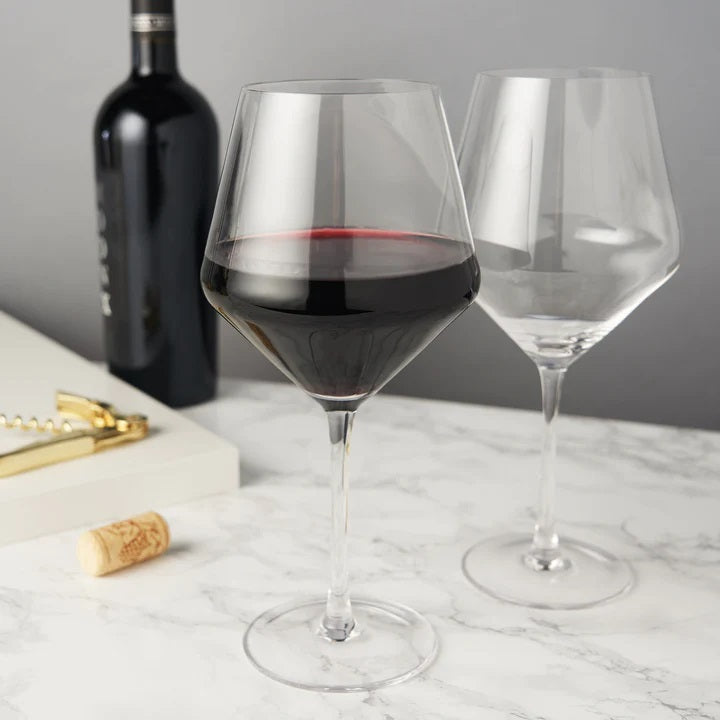 Stunning lead-free Crystal Glasses with tall stems and sleek angles. Enjoy your vintage with this pair of beautifully crafted red wine glasses equally suited for white wines.. Pure elegant drinkware in a boxed set of 2 with 21 oz capacity. 230mm H  Hand wash recommended. Dishwasher safe (top rack only)