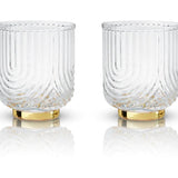 These 1920"s style elegant glasses feature a draping style glass offering a striking silhouette with polished gold plated base. Perfect for whiskey, margarita, negroni and more.  Boxed set of 2 Belmont Gatsby 12 oz Glasses.  High quality glass with gold electroplating.  Handwash only.
