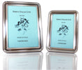 Round Edge Frame in Light Silver (sheet of silver over metal base) with a wood veneer back. Tarnish Free.  Large - 13cm x 18cm (inside measurement)  Gift Boxed  Made in Italy.