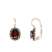 Beautiful Simply Italian classic oval shaped earrings with a Garnet centre and Swarovski crystals. 18ct rose gold plating over a sterling silver base. Leaver back to help them remain secure. Made in Italy. Garnet, Swarvoski Crystal, Sterling Silver, 18ct Rose Gold Plating.