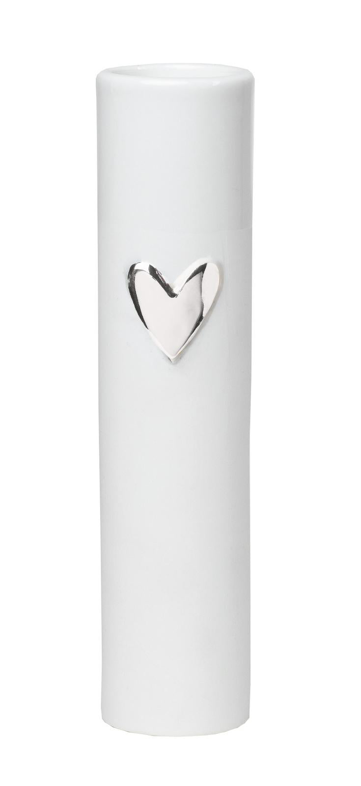 White porcelain vase by Radar with a relief heart finished with in silver.  Size: 40mm diameter x 170mm high